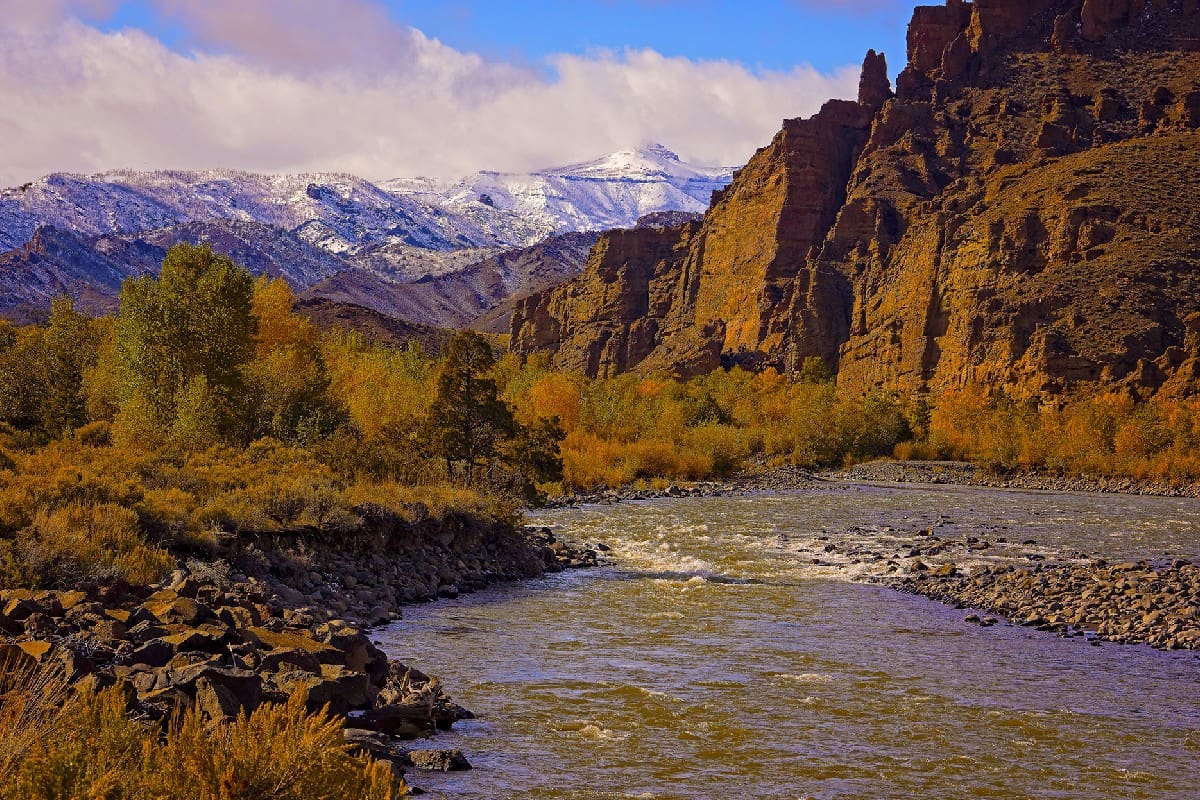 A river with mountains in the background.