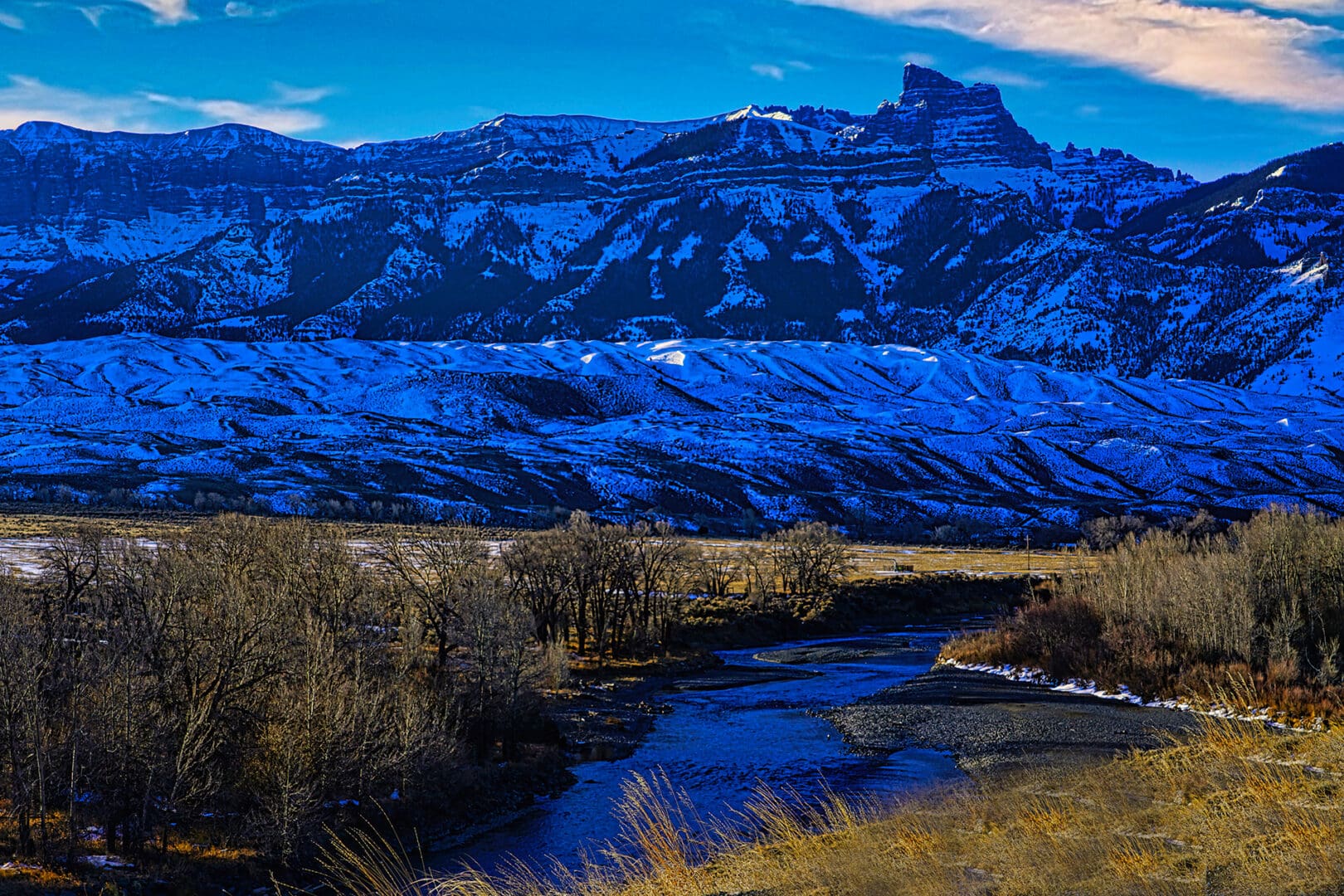 A mountain range with a river running through it.