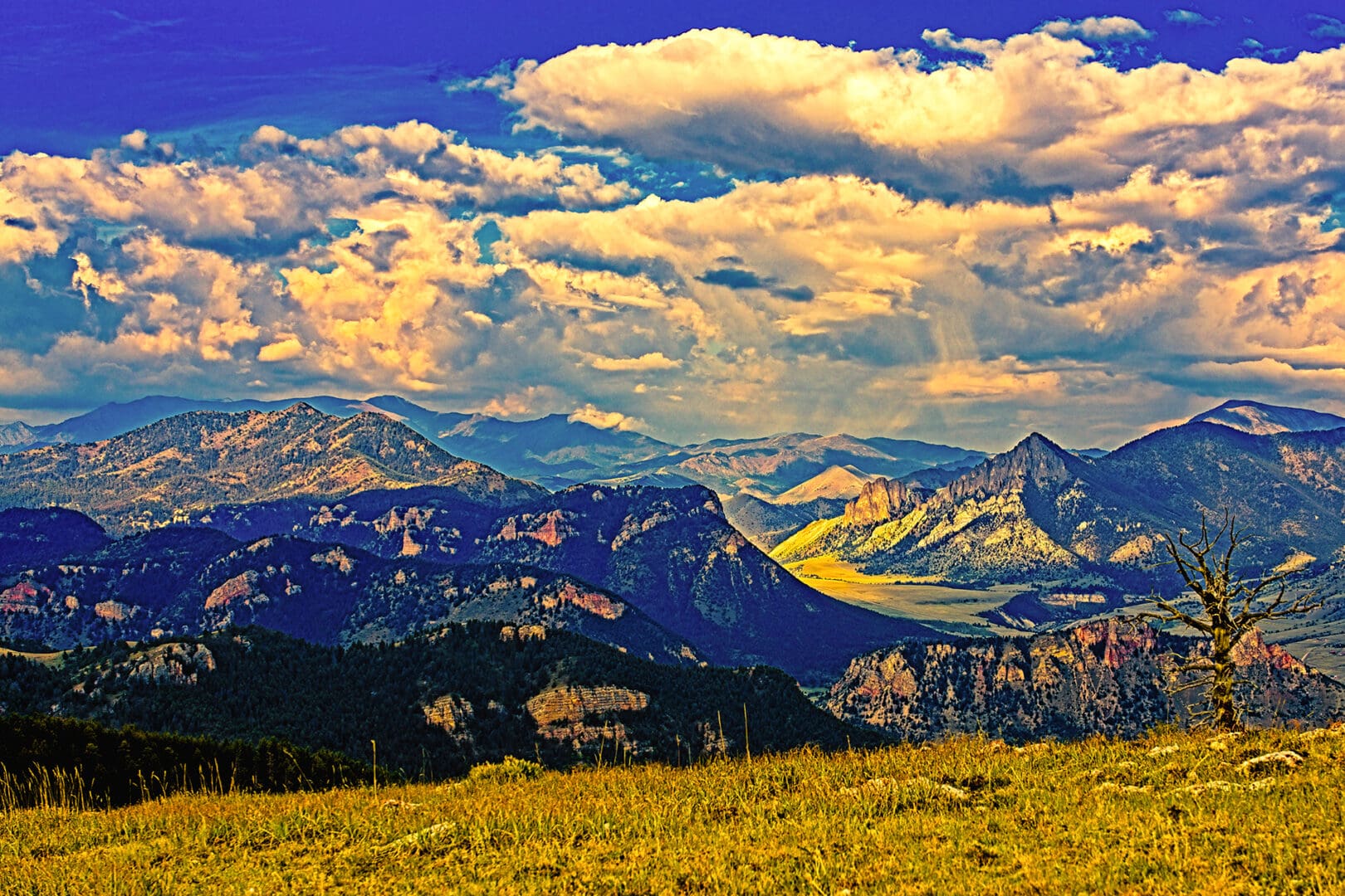 A mountain range with clouds in the sky.