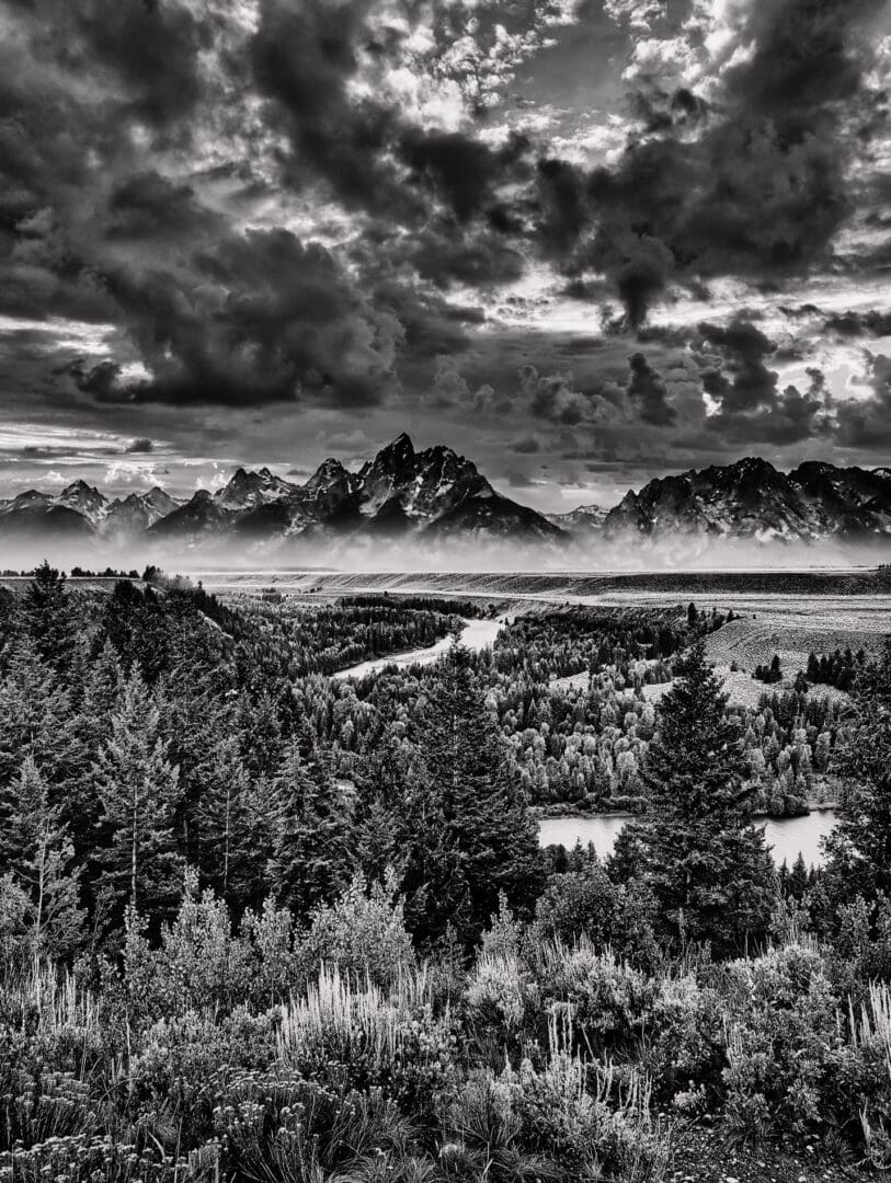 A black and white photo of the grand teton mountains.