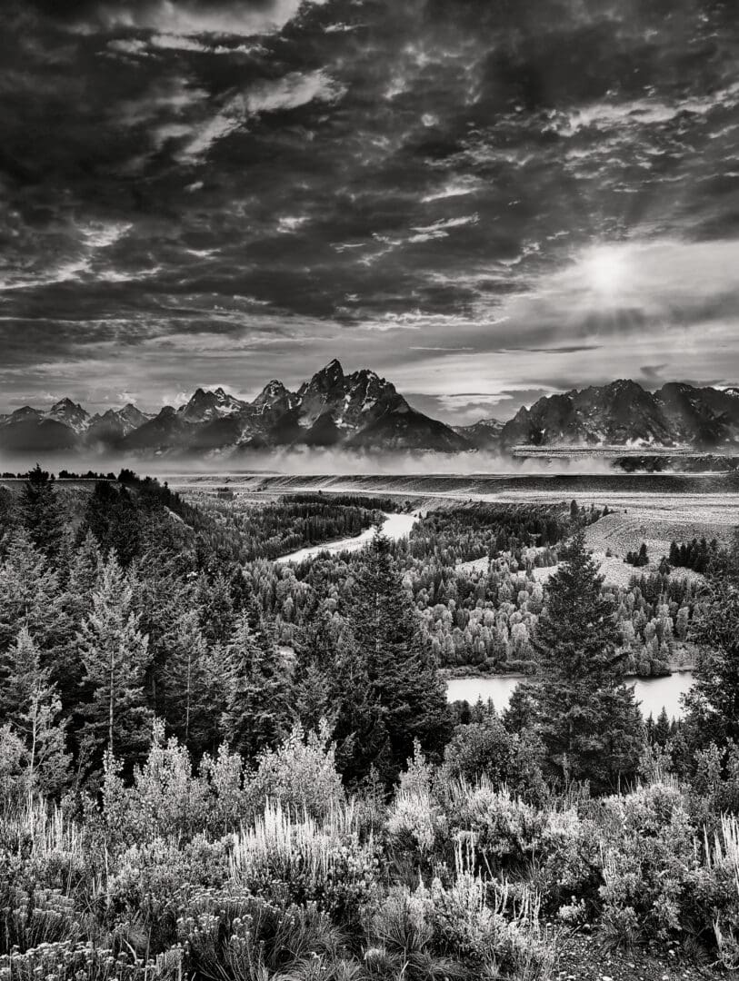 A black and white photo of the grand teton mountains.