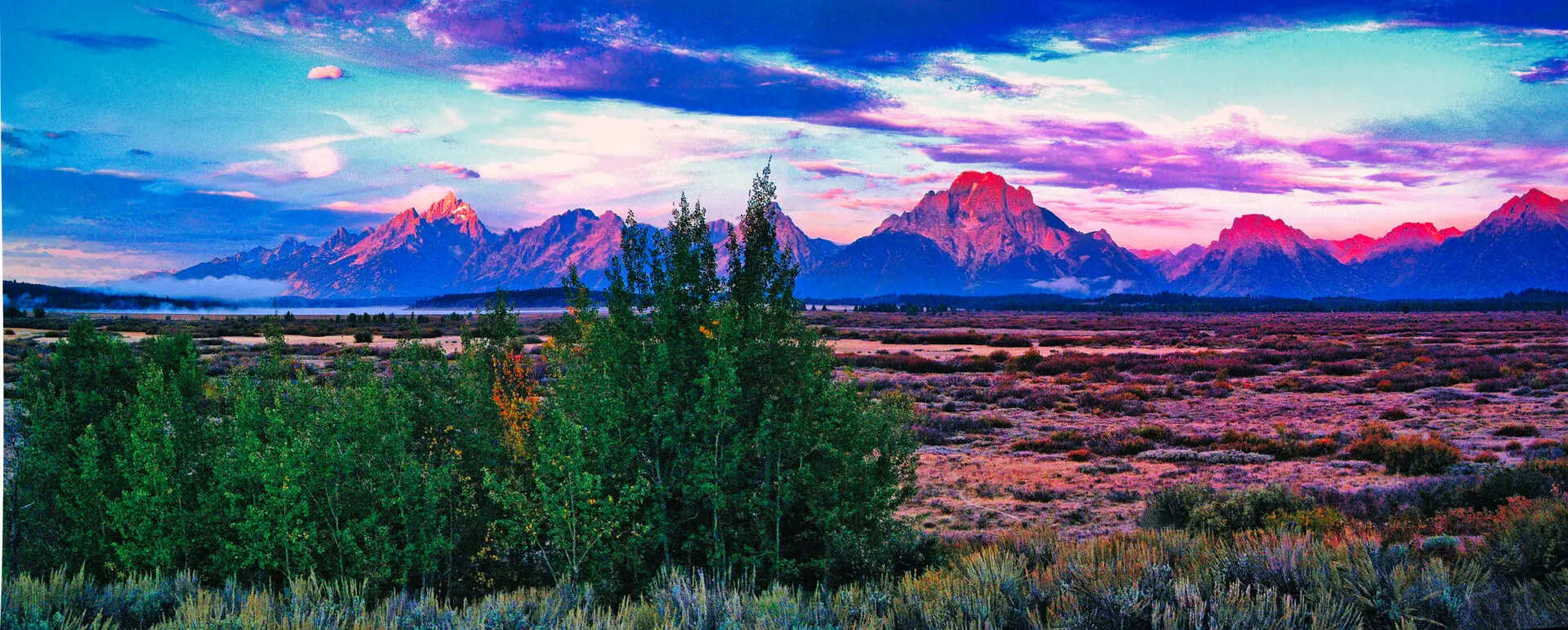 A mountain range is in the foreground.